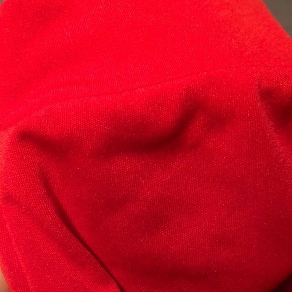 Red slick material - Picture 2 of 4
